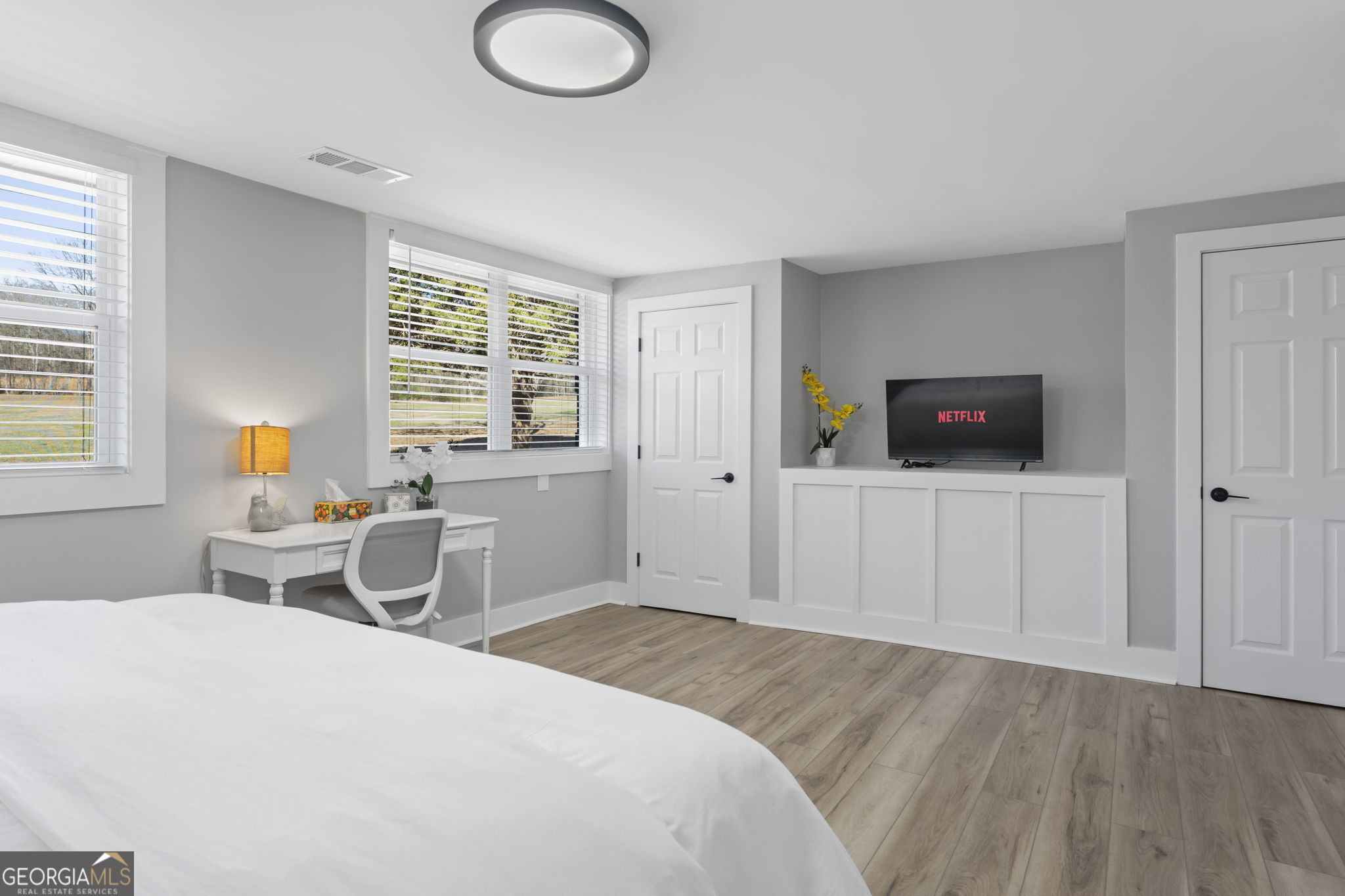 2604 Flat Shoals Road Southwest Conyers, GA 30094 - Photo 23 of 44 a bedroom with a bed and a flat screen tv