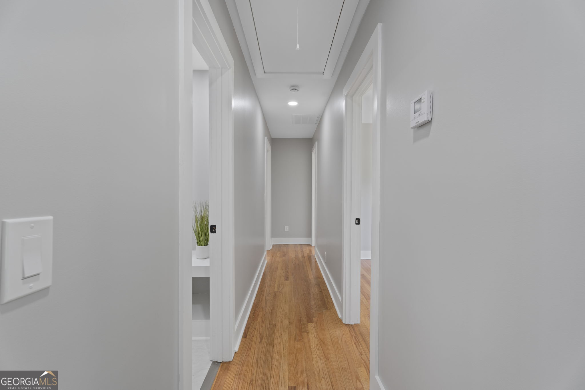 2604 Flat Shoals Road Southwest Conyers, GA 30094 - Photo 25 of 44 a view of a hallway with wooden floor