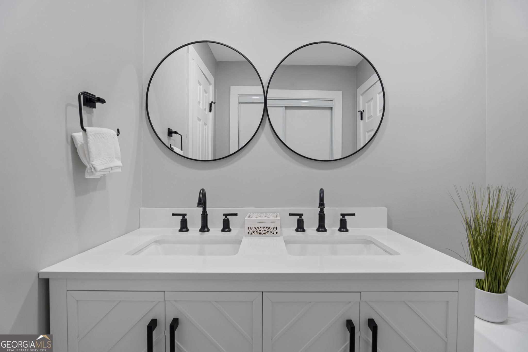 2604 Flat Shoals Road Southwest Conyers, GA 30094 - Photo 27 of 44 a bathroom with a sink and a mirror