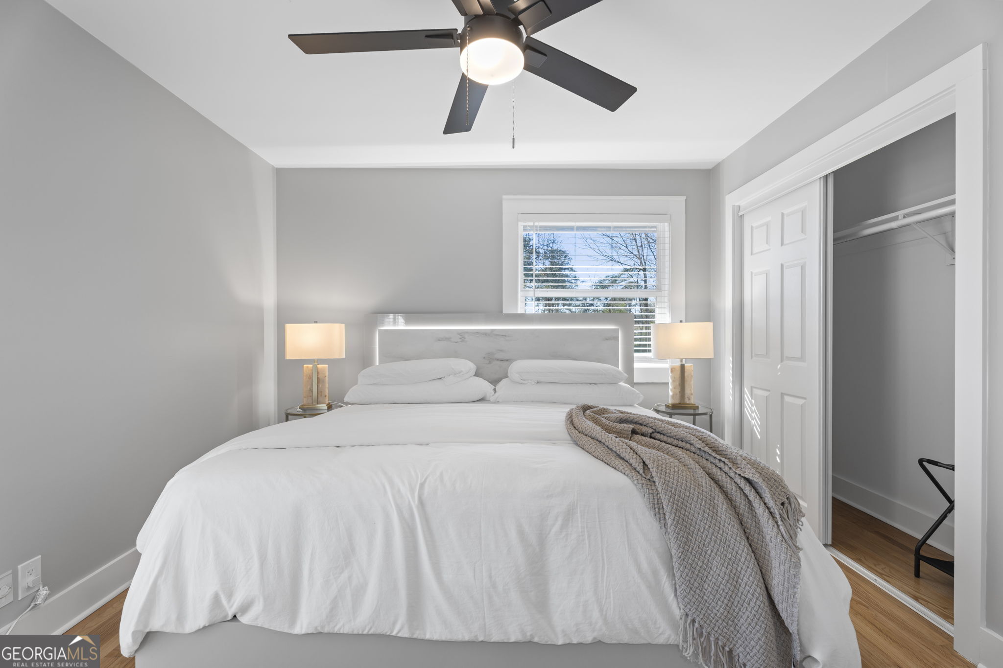 2604 Flat Shoals Road Southwest Conyers, GA 30094 - Photo 33 of 44 a bedroom with a bed and a chandelier