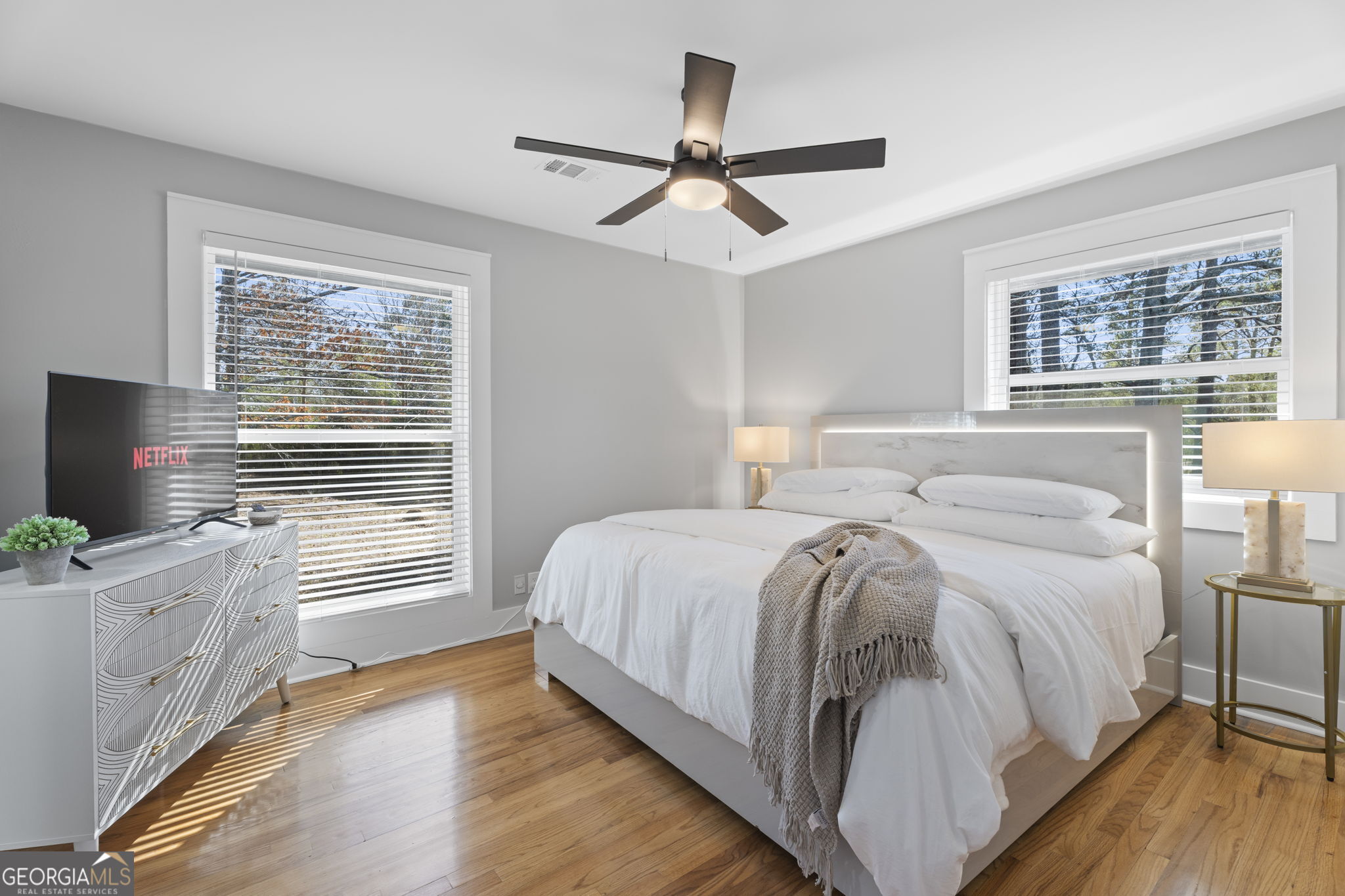 2604 Flat Shoals Road Southwest Conyers, GA 30094 - Photo 34 of 44 a bedroom with a bed and a flat screen tv