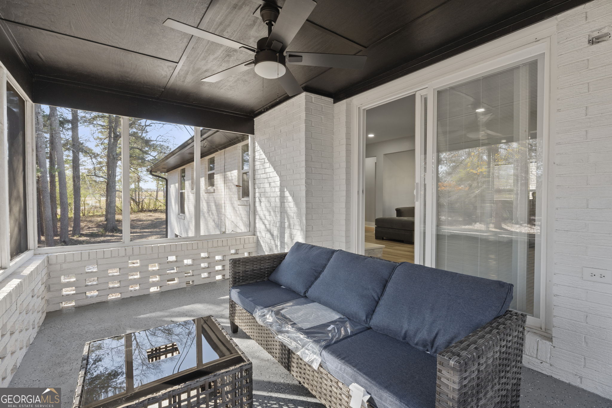 2604 Flat Shoals Road Southwest Conyers, GA 30094 - Photo 37 of 44 a living room with furniture and a large window