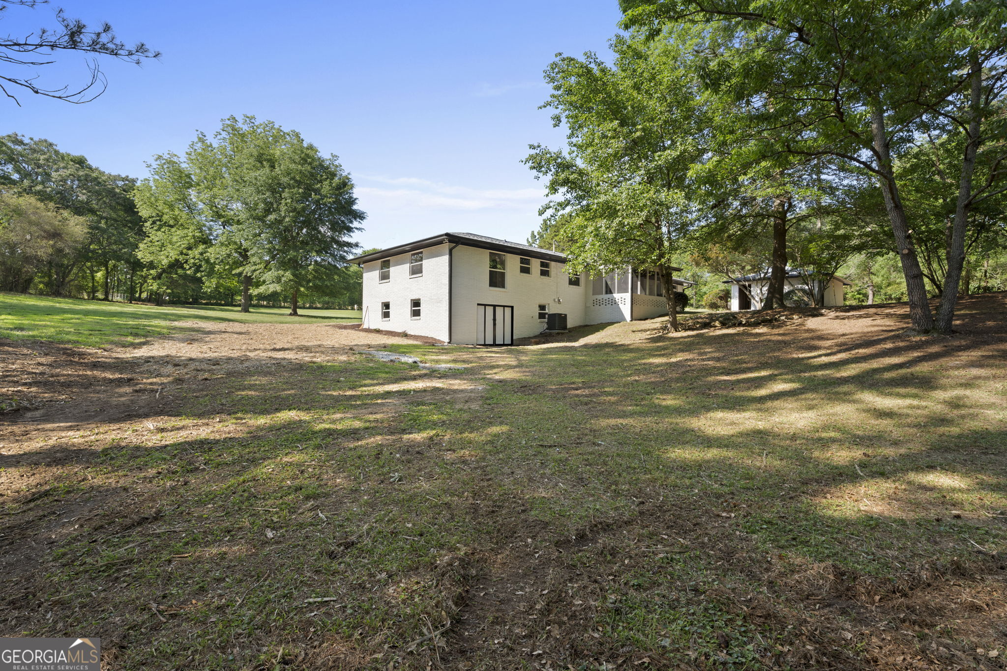 2604 Flat Shoals Road Southwest Conyers, GA 30094 - Photo 40 of 44 a view of a house with a yard