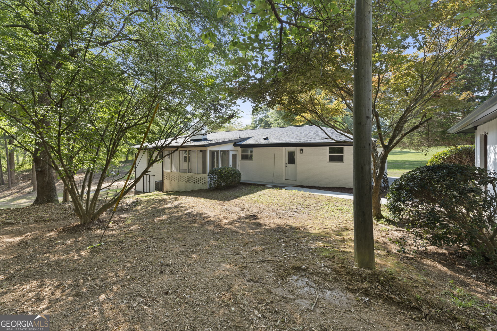 2604 Flat Shoals Road Southwest Conyers, GA 30094 - Photo 41 of 44 a house with trees in front of it