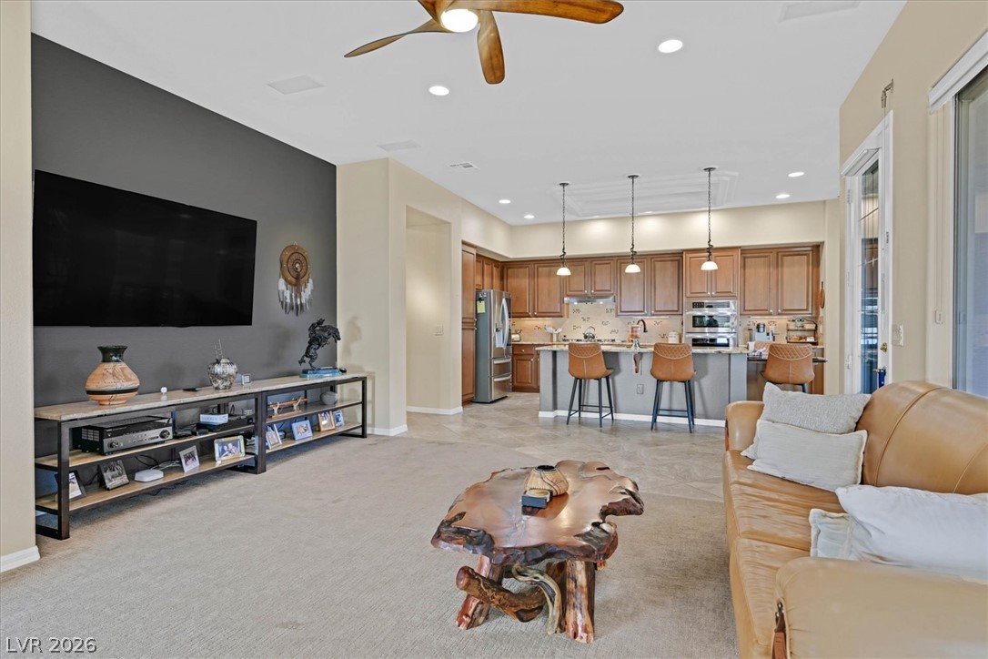 1823 Baton Rouge Street Henderson, NV 89052 - Photo 59 of 60 An open floorplan seamlessly connects the living space to a kitchen with custom wood cabinetry.
