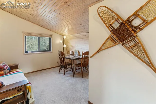 a view of a livingroom with furniture and a window