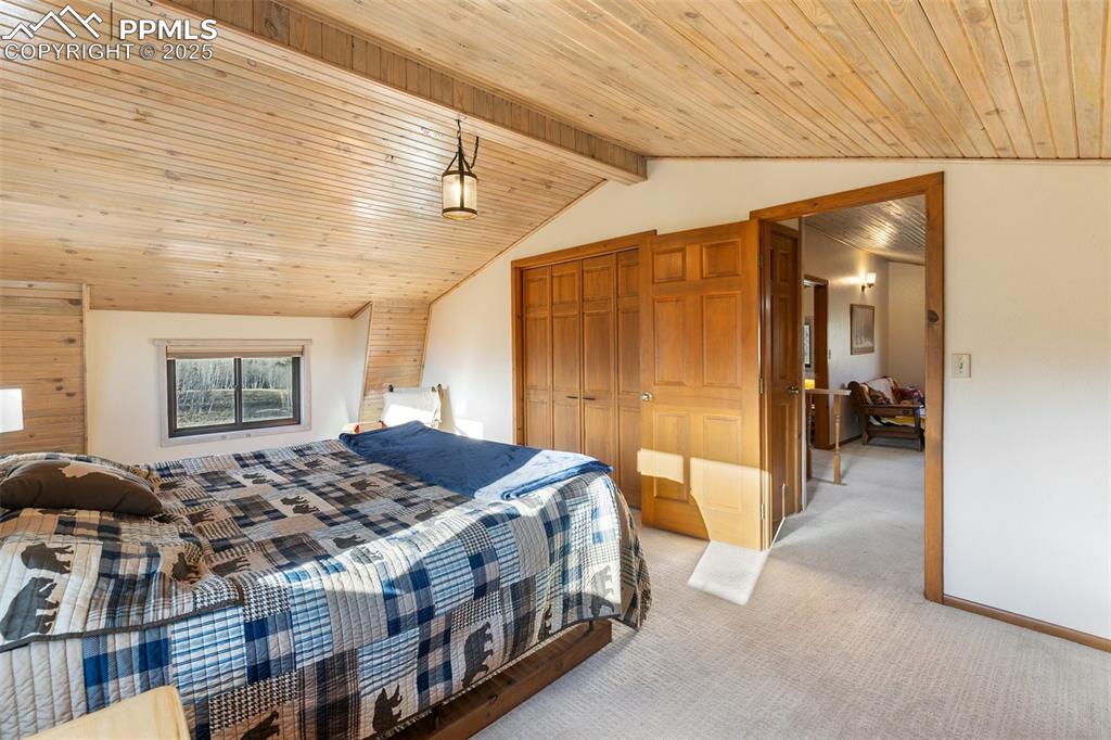 2387 Buffalo Ridge Road Como, CO 80456 - Photo 25 of 50 a spacious bedroom with a bed and a table
