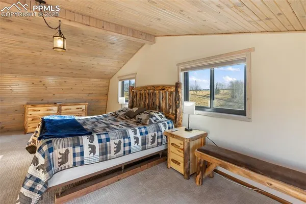 a bedroom with furniture and a window