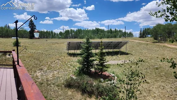 a view of a backyard with sitting area