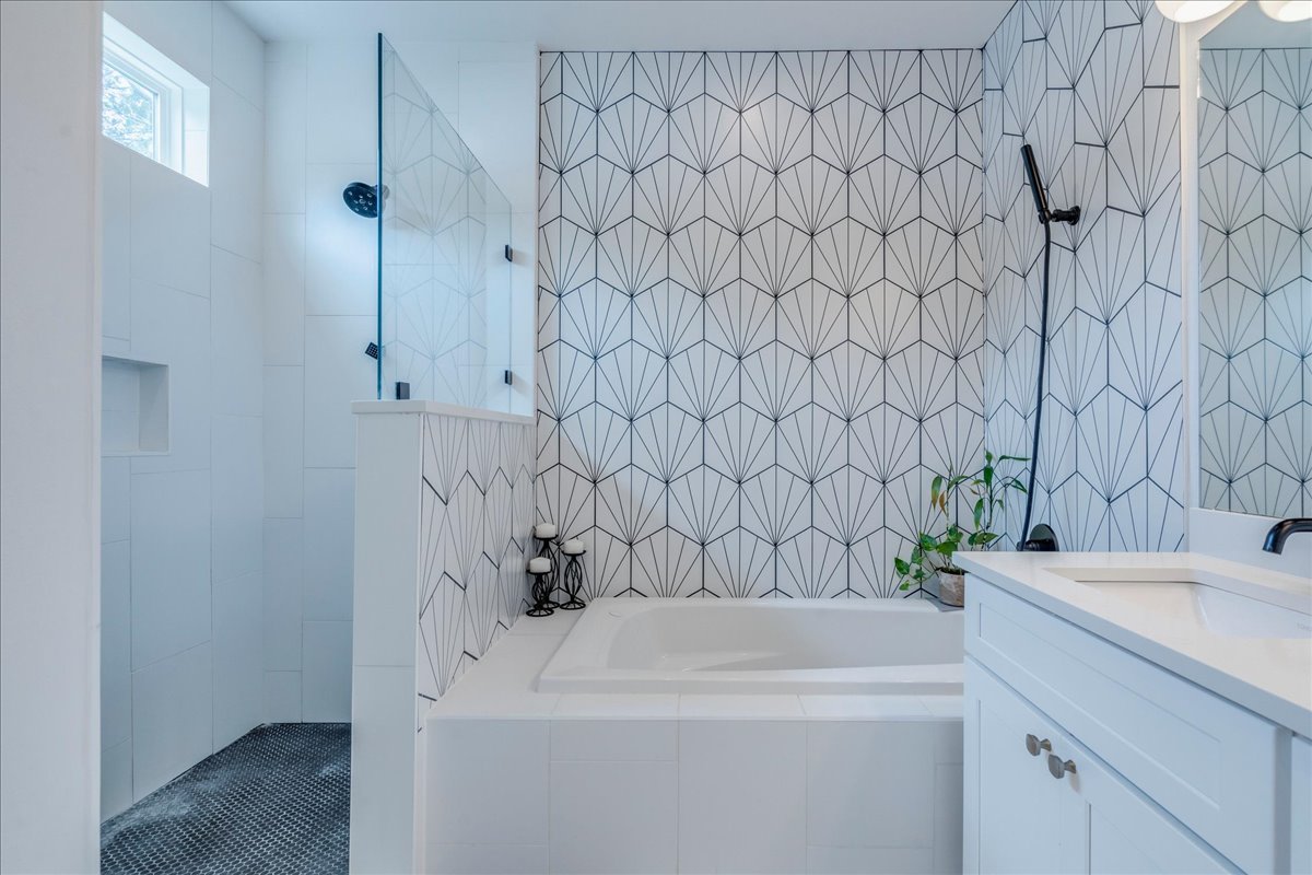 1214 Delano Street, Unit 1 Austin, TX 78721 - Photo 17 of 27 a bathroom with a sink and a mirror