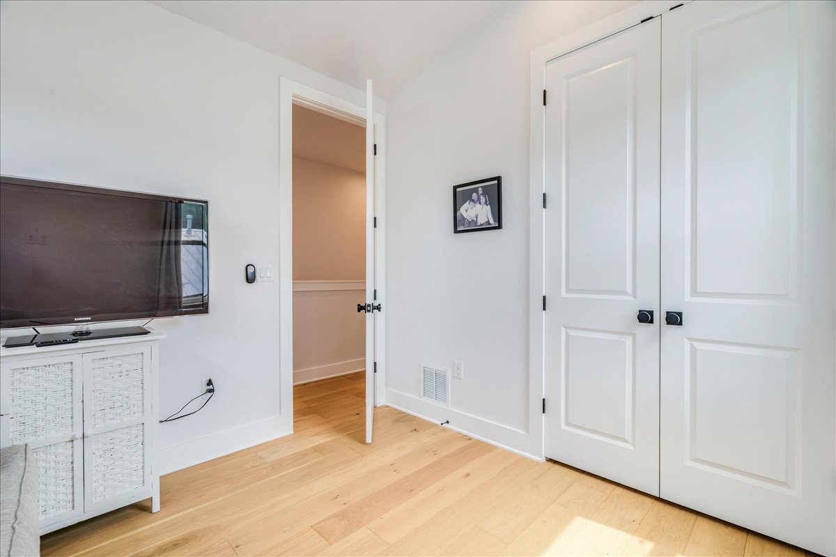 1214 Delano Street, Unit 1 Austin, TX 78721 - Photo 19 of 27 a view of a livingroom with wooden floor and cabinet