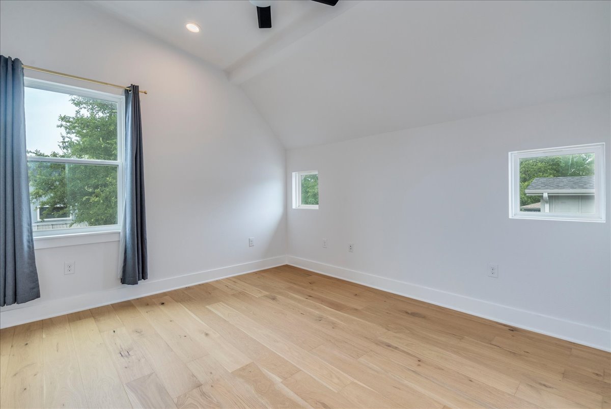 1214 Delano Street, Unit 1 Austin, TX 78721 - Photo 22 of 27 a view of an empty room with a window