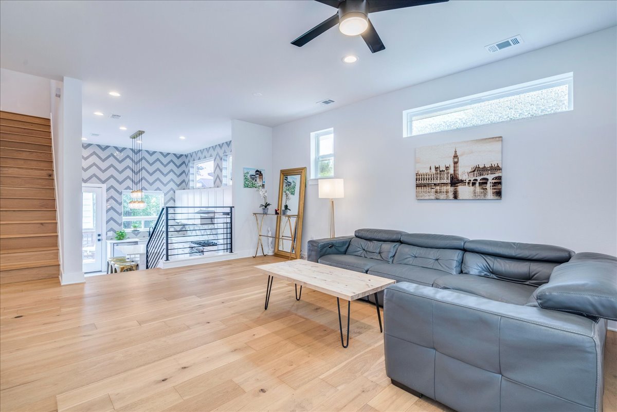 1214 Delano Street, Unit 1 Austin, TX 78721 - Photo 5 of 27 a living room with furniture and a wooden floor