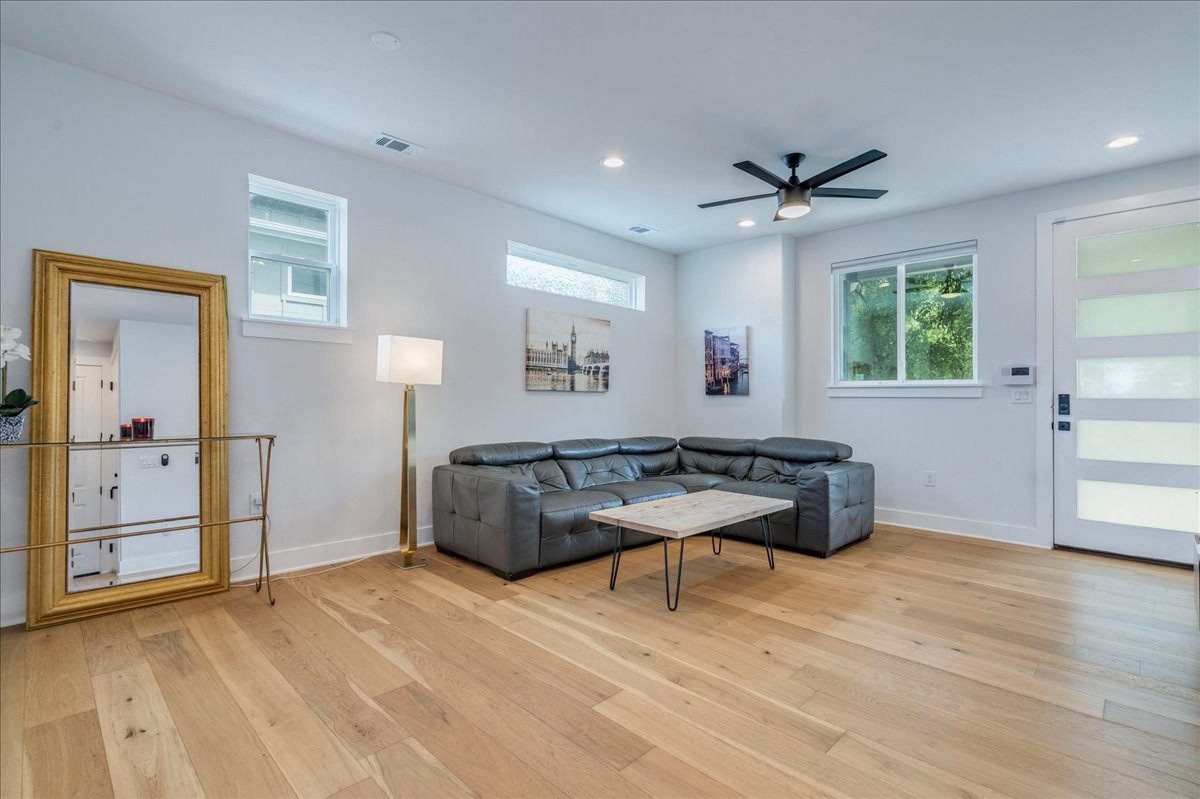 1214 Delano Street, Unit 1 Austin, TX 78721 - Photo 6 of 27 a living room with furniture and a wooden floor