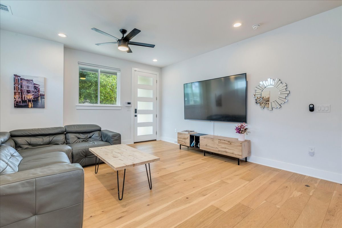 1214 Delano Street, Unit 1 Austin, TX 78721 - Photo 7 of 27 a living room with furniture and a flat screen tv