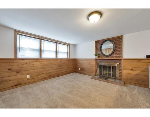 856 Maple Road Longmeadow, MA 01106 - Photo 17 of 27 a view of an empty room with a fireplace and a window
