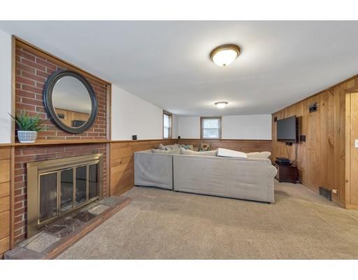 856 Maple Road Longmeadow, MA 01106 - Photo 19 of 27 a living room with stainless steel appliances kitchen island granite countertop a stove a sink a refrigerator and a microwave