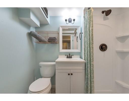 856 Maple Road Longmeadow, MA 01106 - Photo 22 of 27 a bathroom with a toilet sink a mirror and shower