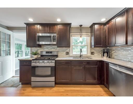 856 Maple Road Longmeadow, MA 01106 - Photo 3 of 27 a kitchen with stainless steel appliances granite countertop a stove a sink and a microwave