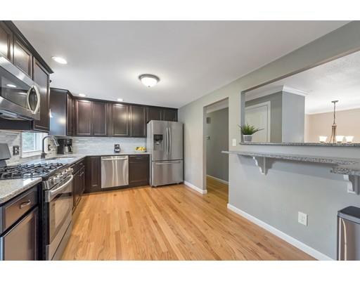 856 Maple Road Longmeadow, MA 01106 - Photo 4 of 27 a open kitchen with stainless steel appliances granite countertop a sink a stove and a refrigerator