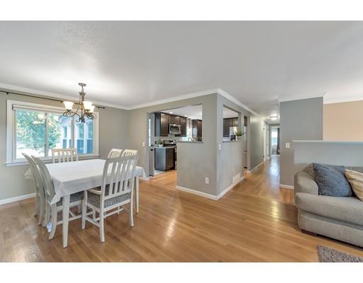 856 Maple Road Longmeadow, MA 01106 - Photo 8 of 27 a living room with furniture and a dining table with kitchen view