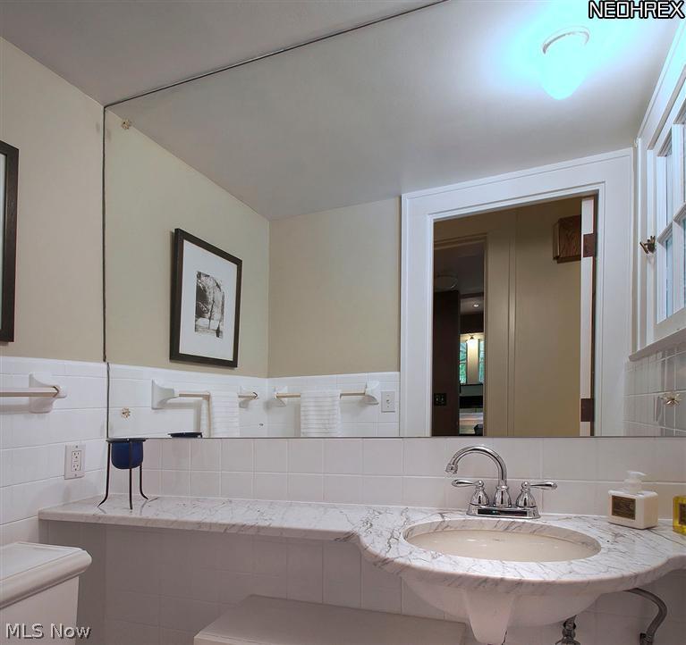 2733 Endicott Road Cleveland, OH 44120 - Photo 14 of 25 New (May'13)freshly painted first floor half bath with custom Carrera marble countertop, fauct, ceramic floor, and Kohler Memoirs commode.