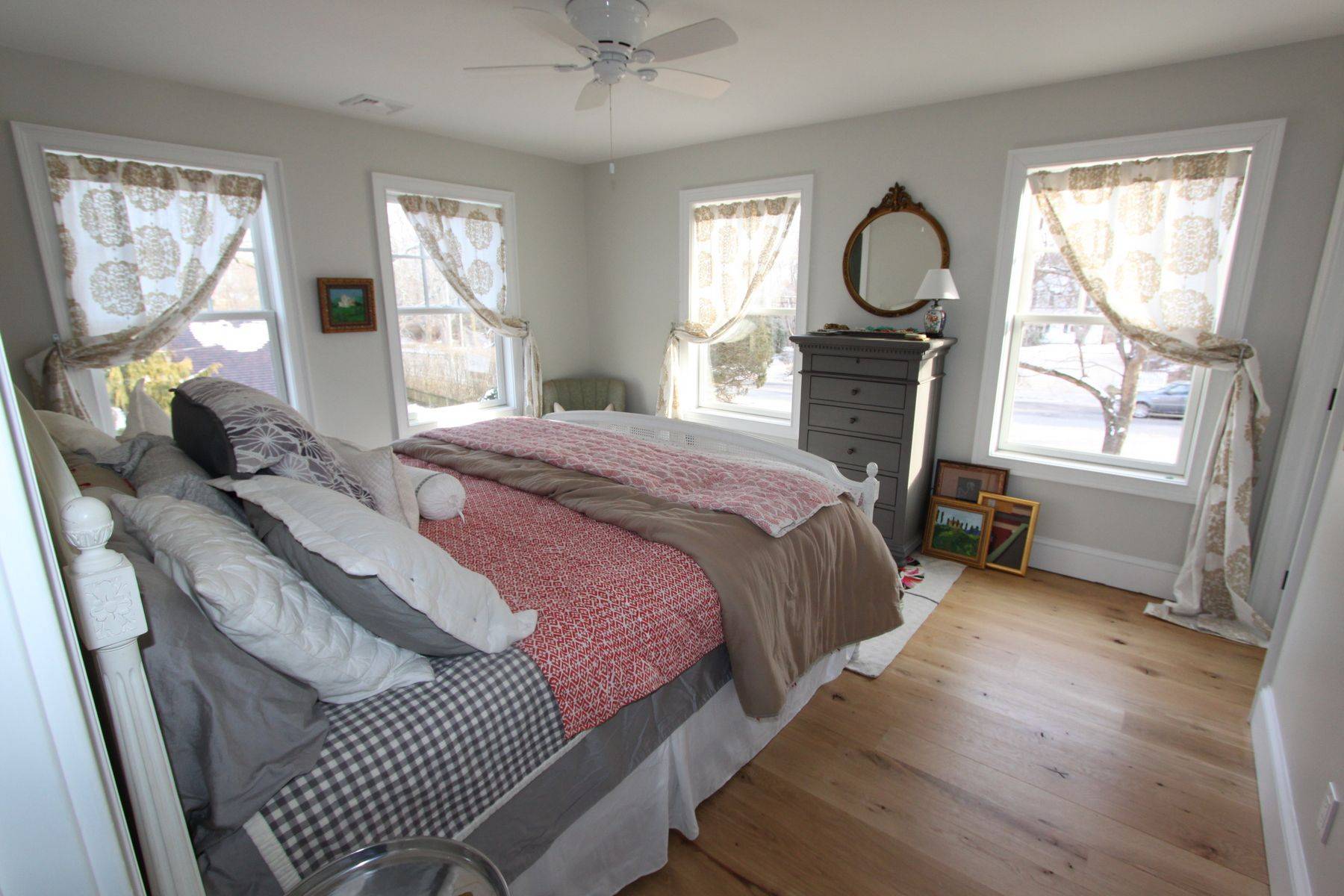7 School Street Bridgehampton, NY 11932 - Photo 5 of 7 a bedroom with a bed a dresser and window