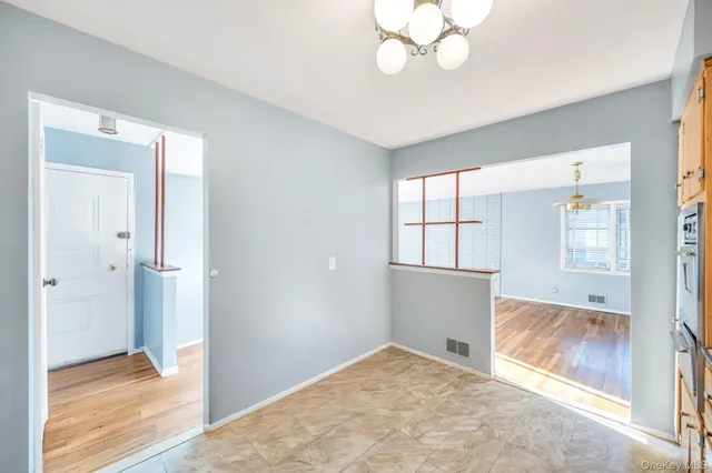 wooden floor and window in an empty room