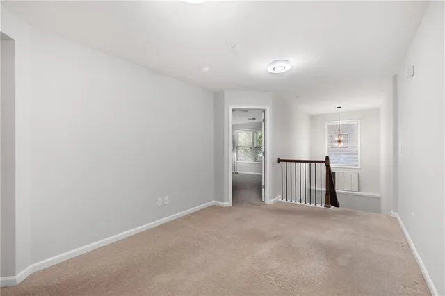 a view of a hallway with closet area