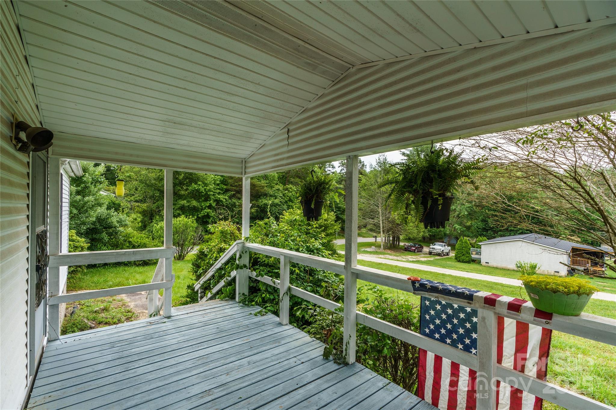 445 Old Holbert Road Hendersonville, NC 28792 - Photo 11 of 13 a view of a porch with wooden floor
