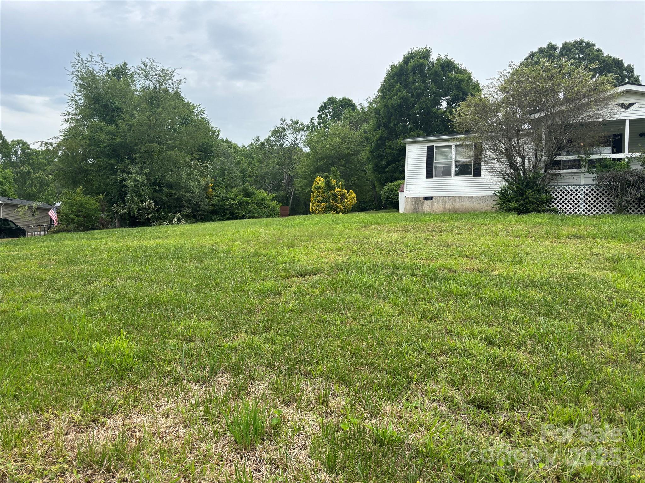 445 Old Holbert Road Hendersonville, NC 28792 - Photo 4 of 13 a front view of a house with garden