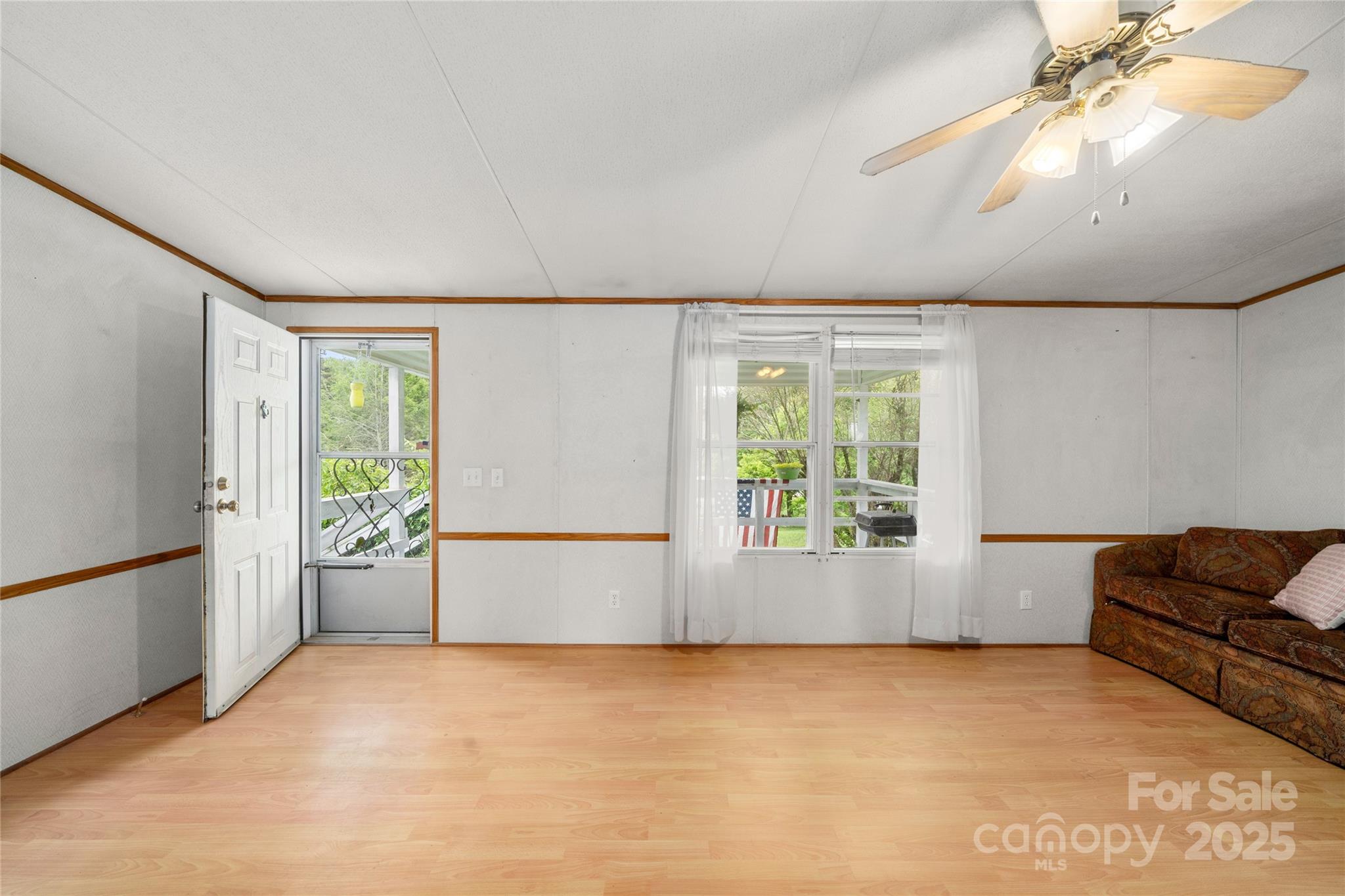 445 Old Holbert Road Hendersonville, NC 28792 - Photo 5 of 13 a view of an empty room with a window
