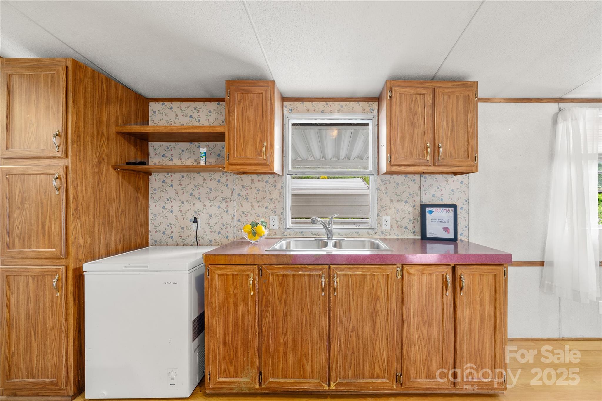 445 Old Holbert Road Hendersonville, NC 28792 - Photo 6 of 13 a kitchen that has a sink and a stove