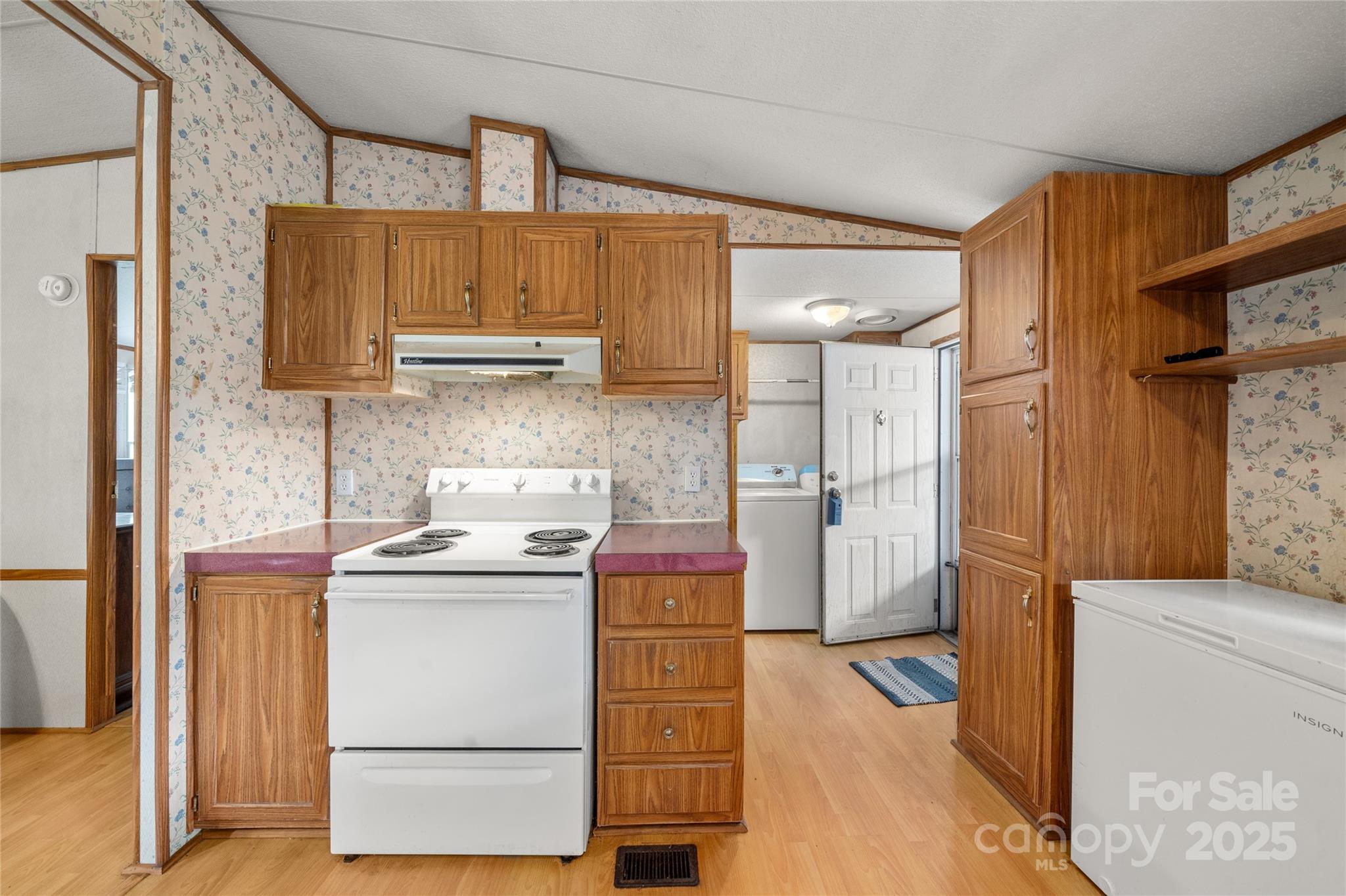 445 Old Holbert Road Hendersonville, NC 28792 - Photo 8 of 13 a kitchen with a stove top oven and refrigerator