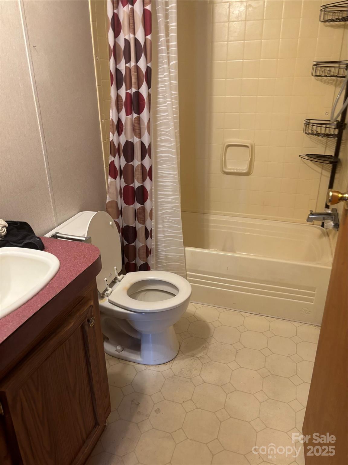 445 Old Holbert Road Hendersonville, NC 28792 - Photo 9 of 13 a bathroom with a toilet a sink and bathtub