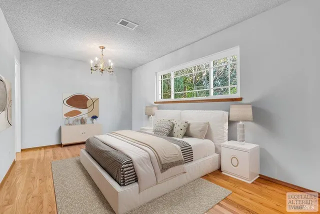 a bathroom with a sink vanity mirror and toilet
