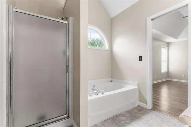 a white bath tub sitting in a bathroom