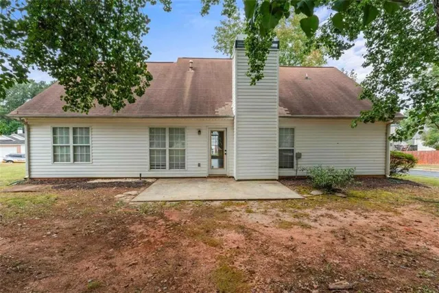 a house view with a backyard space