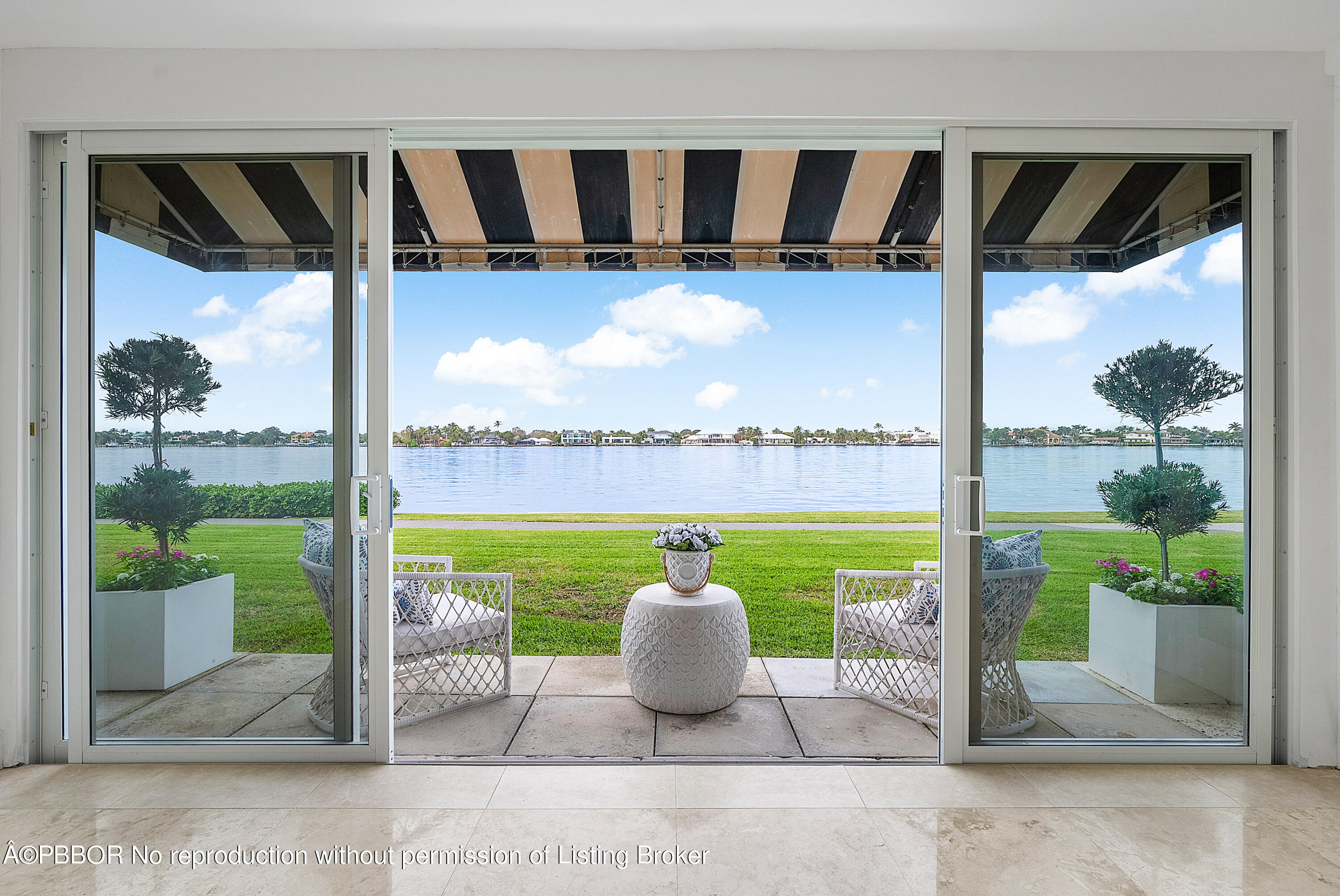 2180 Ibis Isle Road, Unit 5 Palm Beach, FL 33480 - Photo 1 of 39 a view of swimming pool from a porch