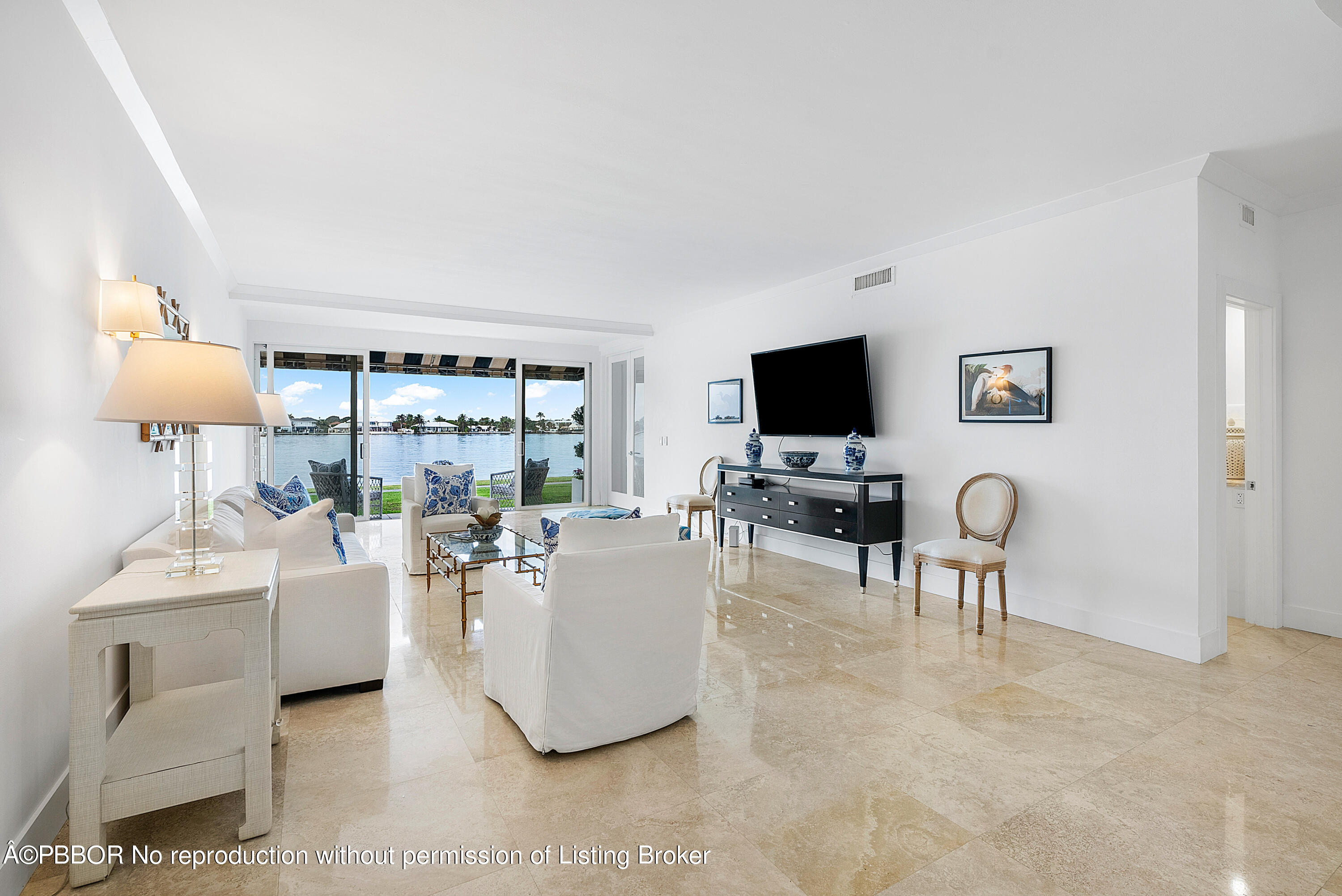 2180 Ibis Isle Road, Unit 5 Palm Beach, FL 33480 - Photo 11 of 39 a living room with furniture and a flat screen tv