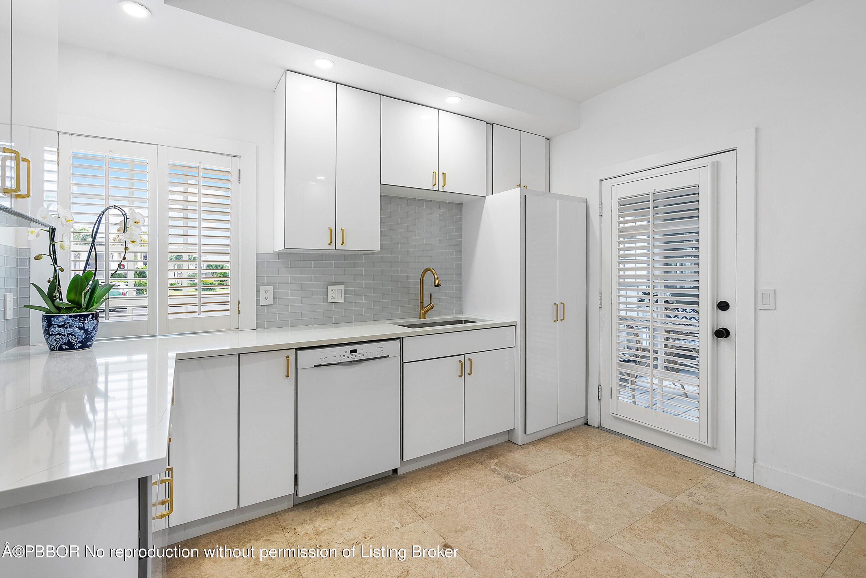 2180 Ibis Isle Road, Unit 5 Palm Beach, FL 33480 - Photo 13 of 39 a kitchen with cabinets and window