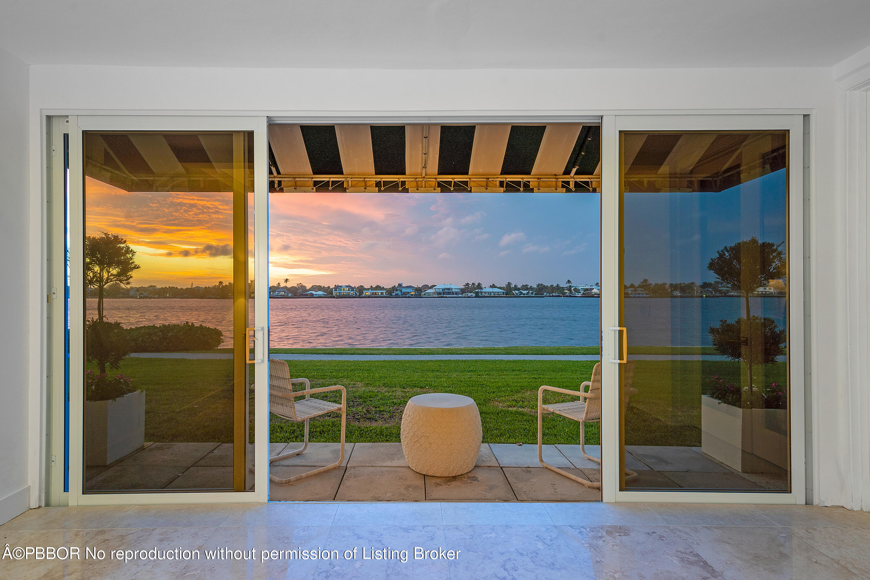 2180 Ibis Isle Road, Unit 5 Palm Beach, FL 33480 - Photo 2 of 39 a view of porch with a table and chair