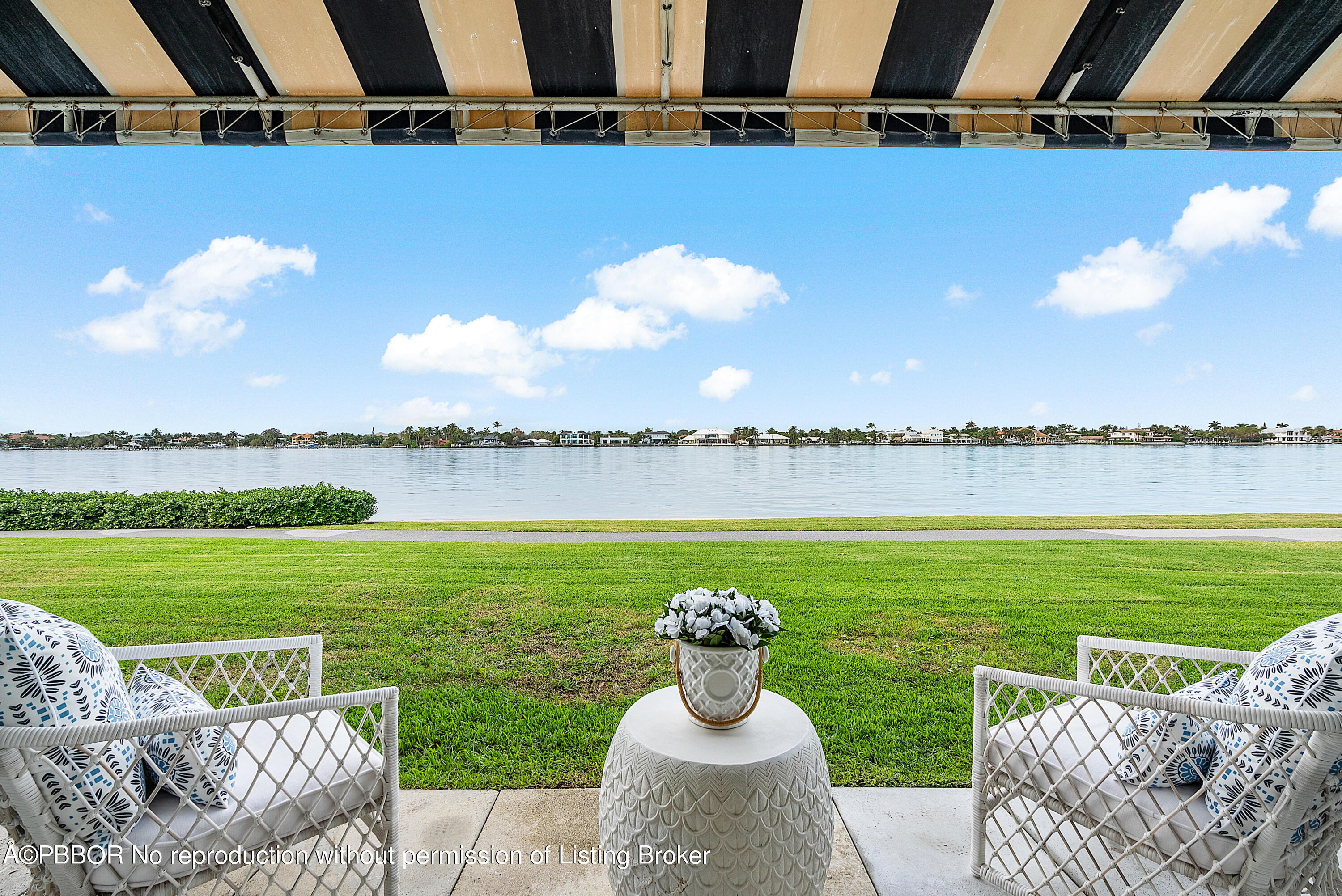 2180 Ibis Isle Road, Unit 5 Palm Beach, FL 33480 - Photo 3 of 39 a view of a garden with a table and chairs