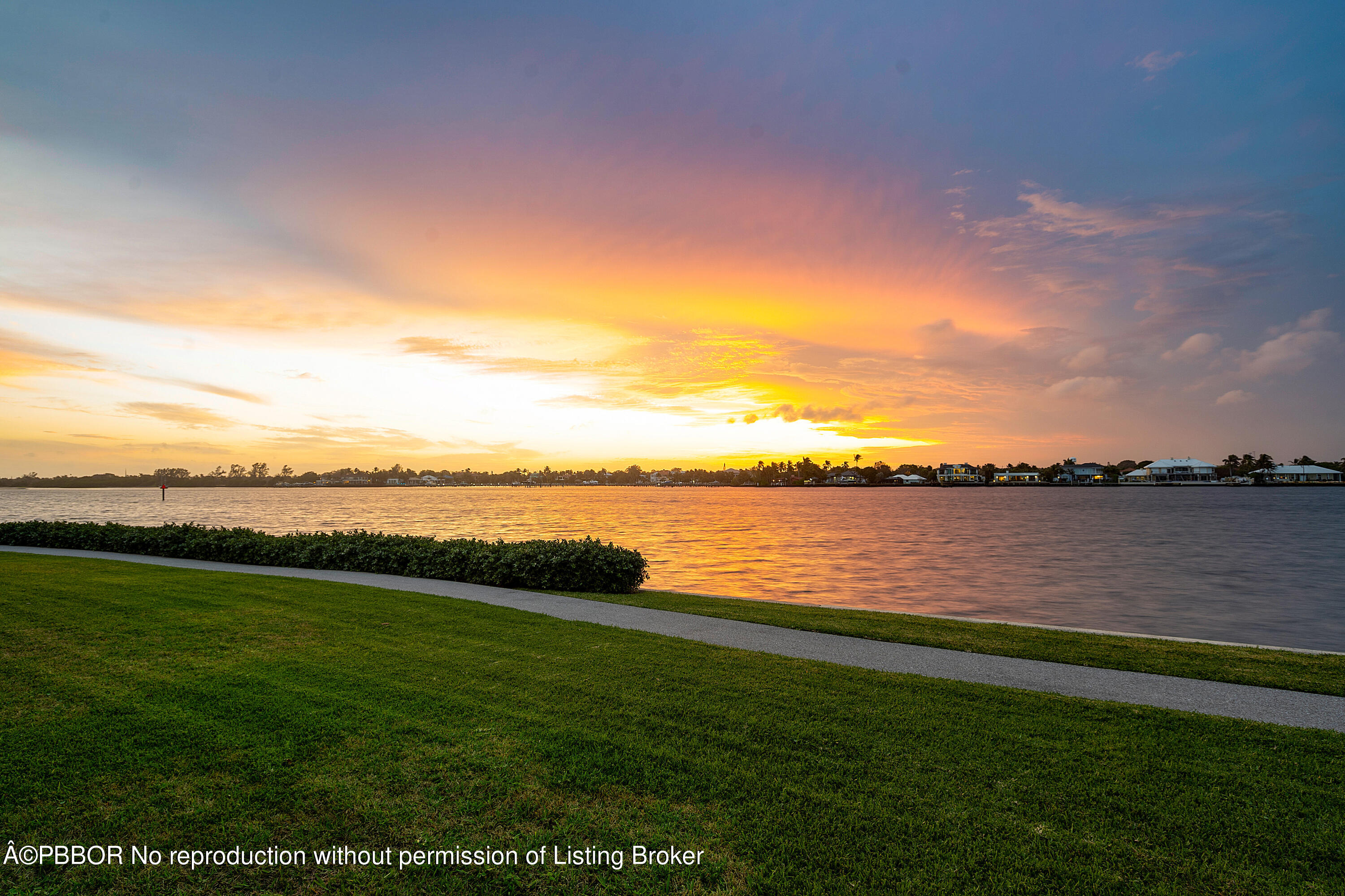 2180 Ibis Isle Road, Unit 5 Palm Beach, FL 33480 - Photo 4 of 39 a view of a lake from a yard