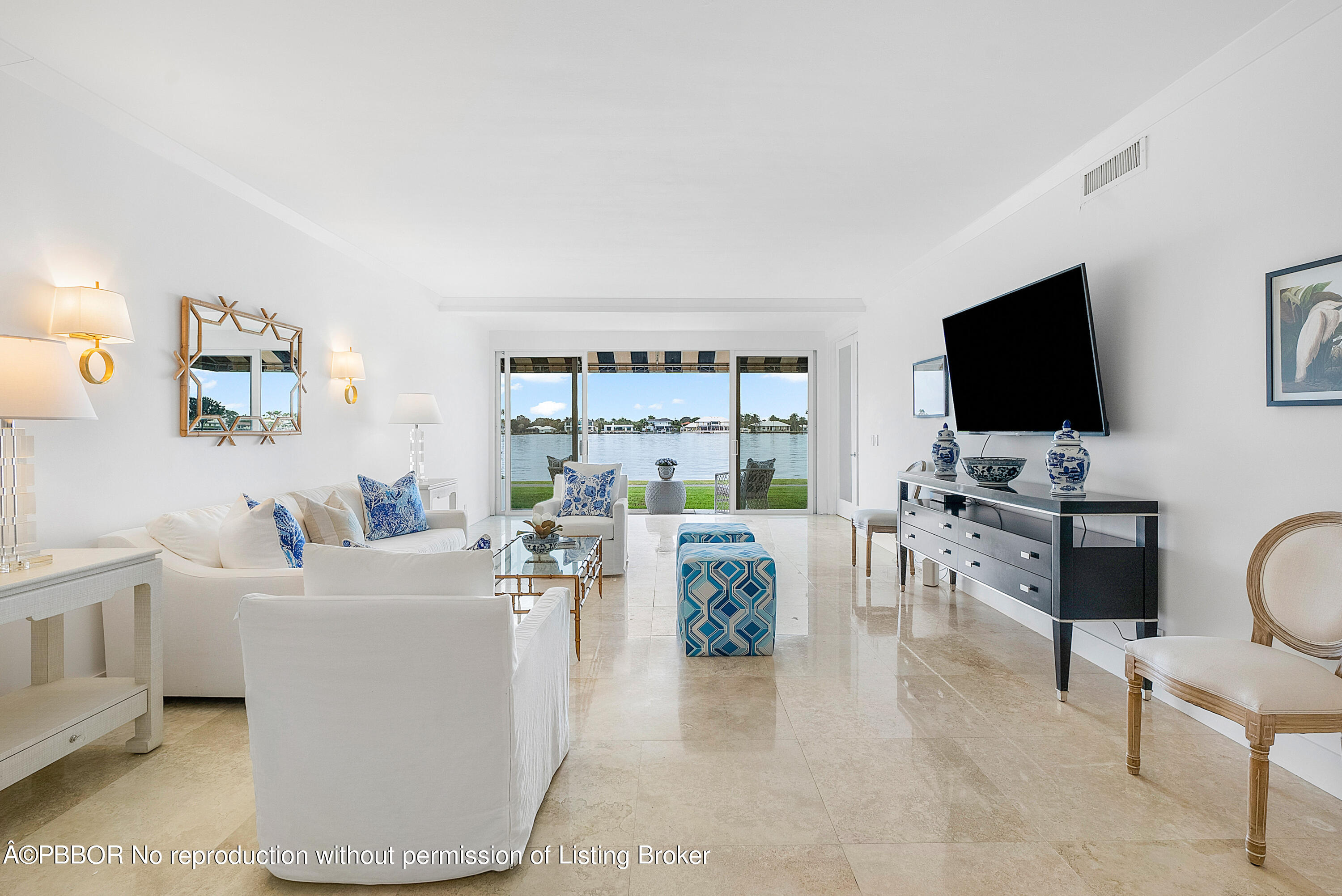 2180 Ibis Isle Road, Unit 5 Palm Beach, FL 33480 - Photo 8 of 39 a living room with furniture and a flat screen tv