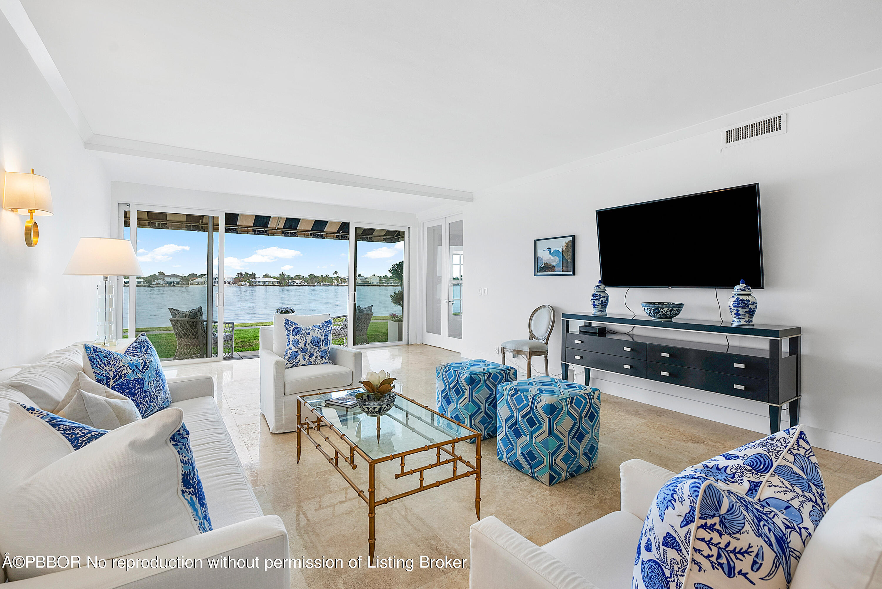 2180 Ibis Isle Road, Unit 5 Palm Beach, FL 33480 - Photo 10 of 39 a living room with furniture and a flat screen tv