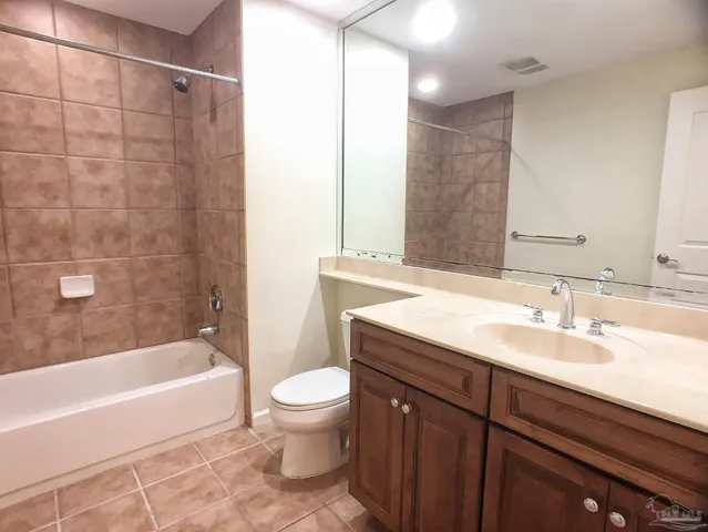 a bathroom with a sink a toilet and bathtub