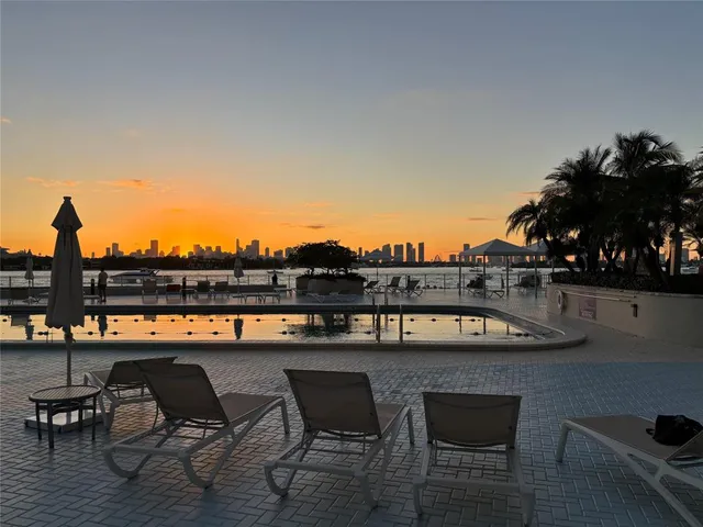 a view of a lobby with furniture and chandelier