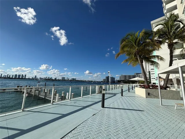 a view of a swimming pool with outdoor seating