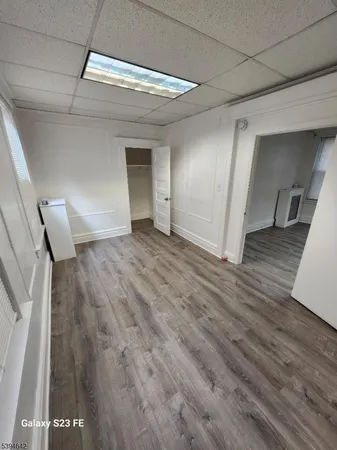 a view of a livingroom with wooden floor